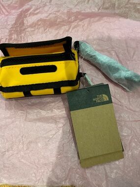 The North Face mini keychain duffle in Summit Gold yellow new with tag